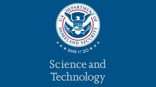 Vertical S&T wordmark/lockup in gray with "DHS at 20" below the DHS seal
