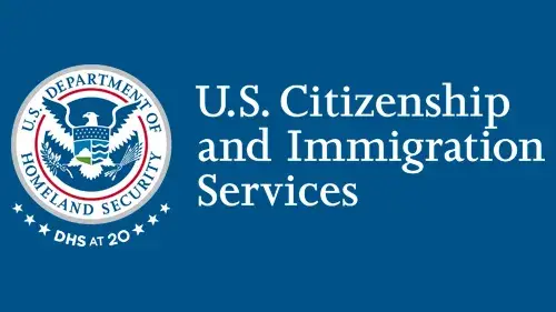 Horizontal USCIS wordmark/lockup in white with "DHS at 20" below the DHS seal