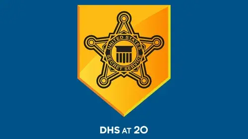 USSS logo with "DHS at 20" below the USSS logo in white