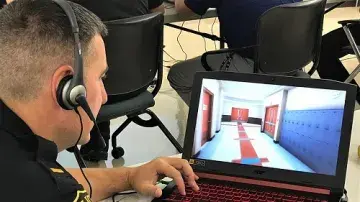 A police officer navigates through the EDGE virtual school environment.