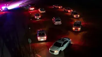 Cars at night time roadblock