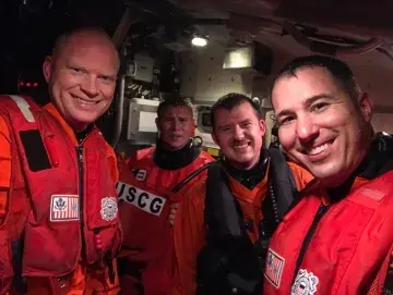 Four members of the Air Station Sitka’s MH-60 Jayhawk helicopter crew 