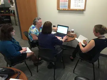 A team conducting a usability test at a USCIS field office