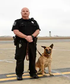 In Memoriam photo of K9 Blues with handler, Transportation Security Administration