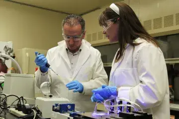 Dr. Rabih Jabbour, a DEVCOM CBC scientist, works alongside Helen Mearns, deputy director of the DHS S&T CSAC, in the new Chemical Security Laboratory at Aberdeen Proving Ground, Maryland.