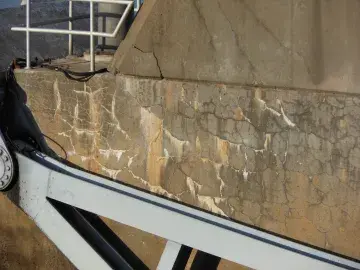 Up-close image of a part of a concrete dam.