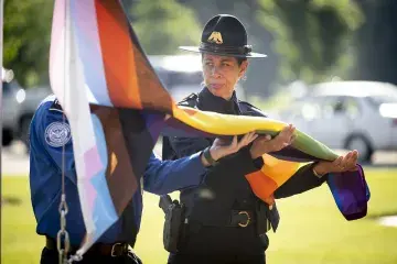 Woman holding the Pride flag