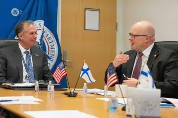 Under Secretary Kusnezov and Ambassador Hautala of Finland at the January 29 signing sitting in a room around a table having a discussion.