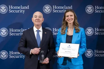 DHS Secretary Alejandro Mayorkas with Champion of Equity Award recipient, Hannah Waldhorn.