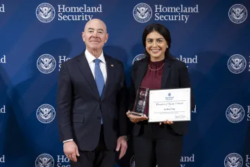 DHS Secretary Alejandro Mayorkas with Champion of Equity Award recipient, Joy Marie Virga.