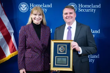 Acting DHS Deputy Secretary Kristie Canegallo with Leadership Excellence Award recipient, Scott McConnell.