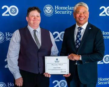 Innovation Award recipient, Lauren Fulton, with DHS Deputy Secretary John Tien.