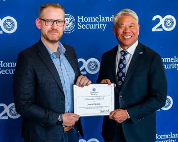 Innovation Award recipient, Justin McBride, with DHS Deputy Secretary John Tien.