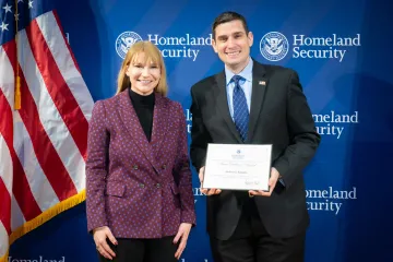 Acting DHS Deputy Secretary Kristie Canegallo with Team Excellence Award recipient, Anthony Battaglia.