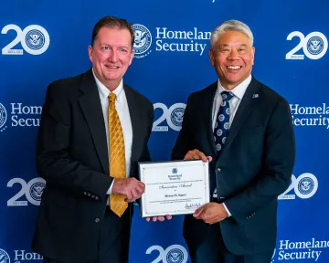 Innovation Award recipient, Michael Segner, with DHS Deputy Secretary John Tien.