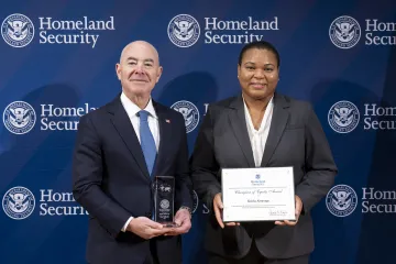 DHS Secretary Alejandro Mayorkas with Champion of Equity Award recipient, Keisha Alvarenga.