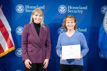 Acting DHS Deputy Secretary Kristie Canegallo with Team Excellence Award recipient, Celinda Moening.