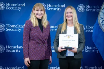 Acting DHS Deputy Secretary Kristie Canegallo and Secretary's Gold Medal recipient, Karen Attardo.