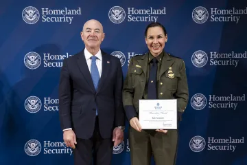 DHS Secretary Alejandro Mayorkas with Innovation Award recipient, Kelly Tumminelli.