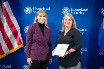 Acting DHS Deputy Secretary Kristie Canegallo with Team Excellence Award recipient, Helen Jackson.