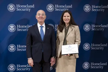 DHS Secretary Alejandro Mayorkas with Innovation Award recipient, Adina Pantella.