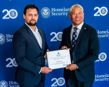 Innovation Award recipient, John Garvin, with DHS Deputy Secretary John Tien.