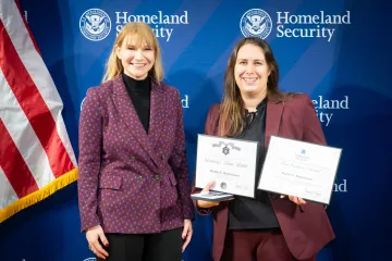 Acting DHS Deputy Secretary Kristie Canegallo with Team Excellence Award recipient, Heather Bartholomew.