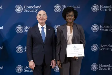 DHS Secretary Alejandro Mayorkas with Innovation Award recipient, Fran Swearengen.