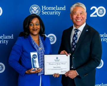 Champion of Equity Award recipient, Tamica Solomon, with DHS Deputy Secretary John Tien.
