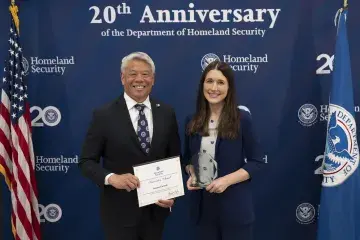 DHS Deputy Secretary John Tien with Innovation Award recipient, Suzanne Carmody.
