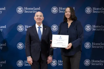 DHS Secretary Alejandro Mayorkas with Innovation Award recipient, Larysa Yarmolenko.