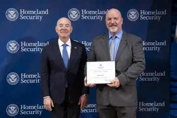 DHS Secretary Alejandro Mayorkas with Innovation Award recipient, Rob Paulette.
