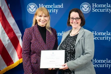 Acting DHS Deputy Secretary Kristie Canegallo with Team Excellence Award recipient, Rachel Liang.