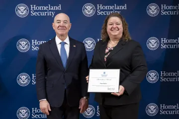 DHS Secretary Alejandro Mayorkas with Innovation Award recipient, Dana Barber.