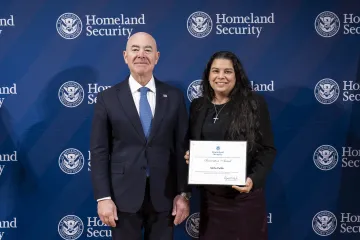 DHS Secretary Alejandro Mayorkas with Innovation Award recipient, Melba Padilla.