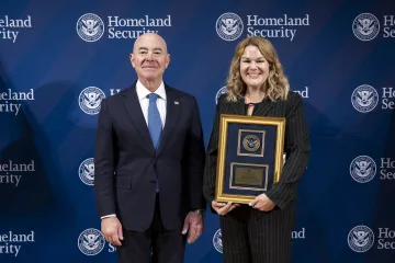 DHS Secretary Alejandro Mayorkas with Leadership Excellence Award recipient, Christina Chesterfield.