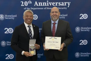 DHS Deputy Secretary John Tien and Secretary's Gold Medal recipient Paul Cervantes.