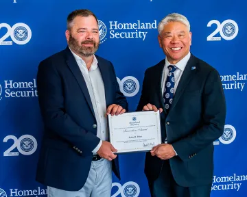 Innovation Award recipient, Pedro Perez, with DHS Deputy Secretary John Tien.