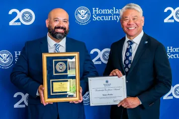 Leadership Excellence Award recipient, Ruben Florido, with DHS Deputy Secretary John Tien.