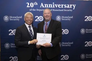 DHS Deputy Secretary John Tien with Team Excellence Award recipient, Kevin Rourke.