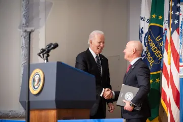 President Biden shakes hands with Secretary Mayorkas