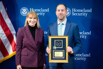 Acting DHS Deputy Secretary Kristie Canegallo with Leadership Excellence Award recipient, Scott Wetzel.