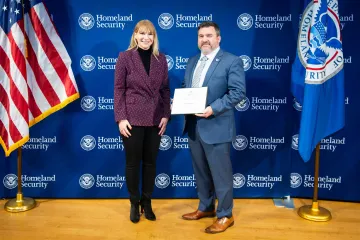 Acting DHS Deputy Secretary Kristie Canegallo with Innovation Award recipient, Benjamin Henry.