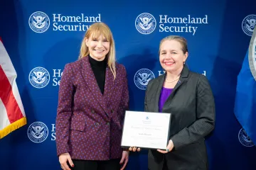 Acting DHS Deputy Secretary Kristie Canegallo with Champion of Equity Award recipient, Acadia Roessner.