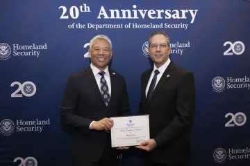 DHS Deputy Secretary John Tien with Team Excellence Award recipient, Michael Creo.