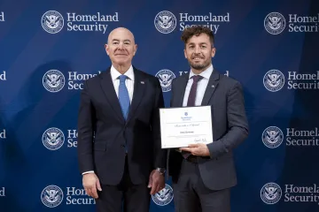 DHS Secretary Alejandro Mayorkas with Innovation Award recipient, David Jennings.