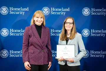 Acting DHS Deputy Secretary Kristie Canegallo with Innovation Award recipient, Megan Mahle.