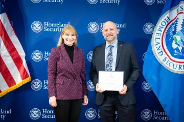 Acting DHS Deputy Secretary Kristie Canegallo with Innovation Award recipient, William Byrd.