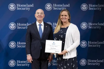 DHS Secretary Alejandro Mayorkas with Innovation Award recipient, Madelyn Dempsey.