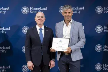 DHS Secretary Alejandro Mayorkas with Innovation Award recipient, Rafael Castro.